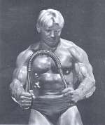 Dave Draper with Weider chest expander.